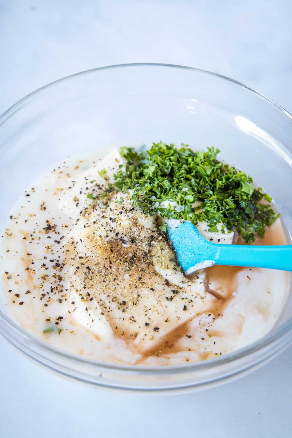 chicken macaroni salad dressing ingredients in a mixing bowl