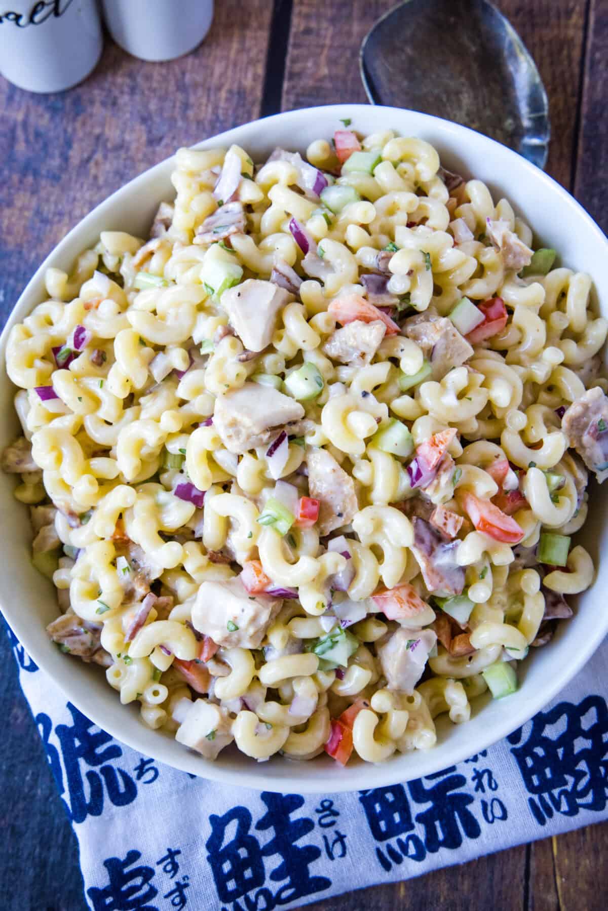 looking down on white bowl with chicken macaroni salad
