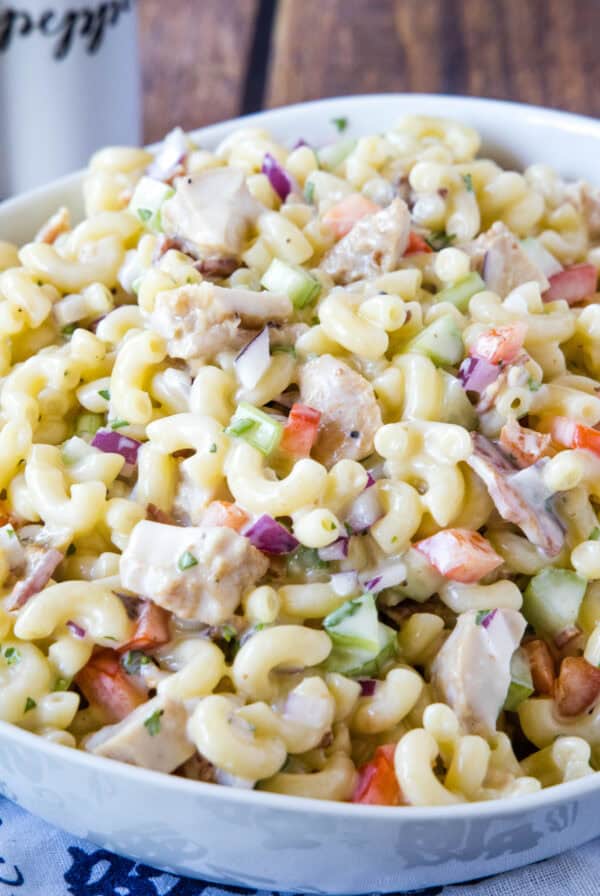 cropped close up chicken macaroni salad in serving bowl