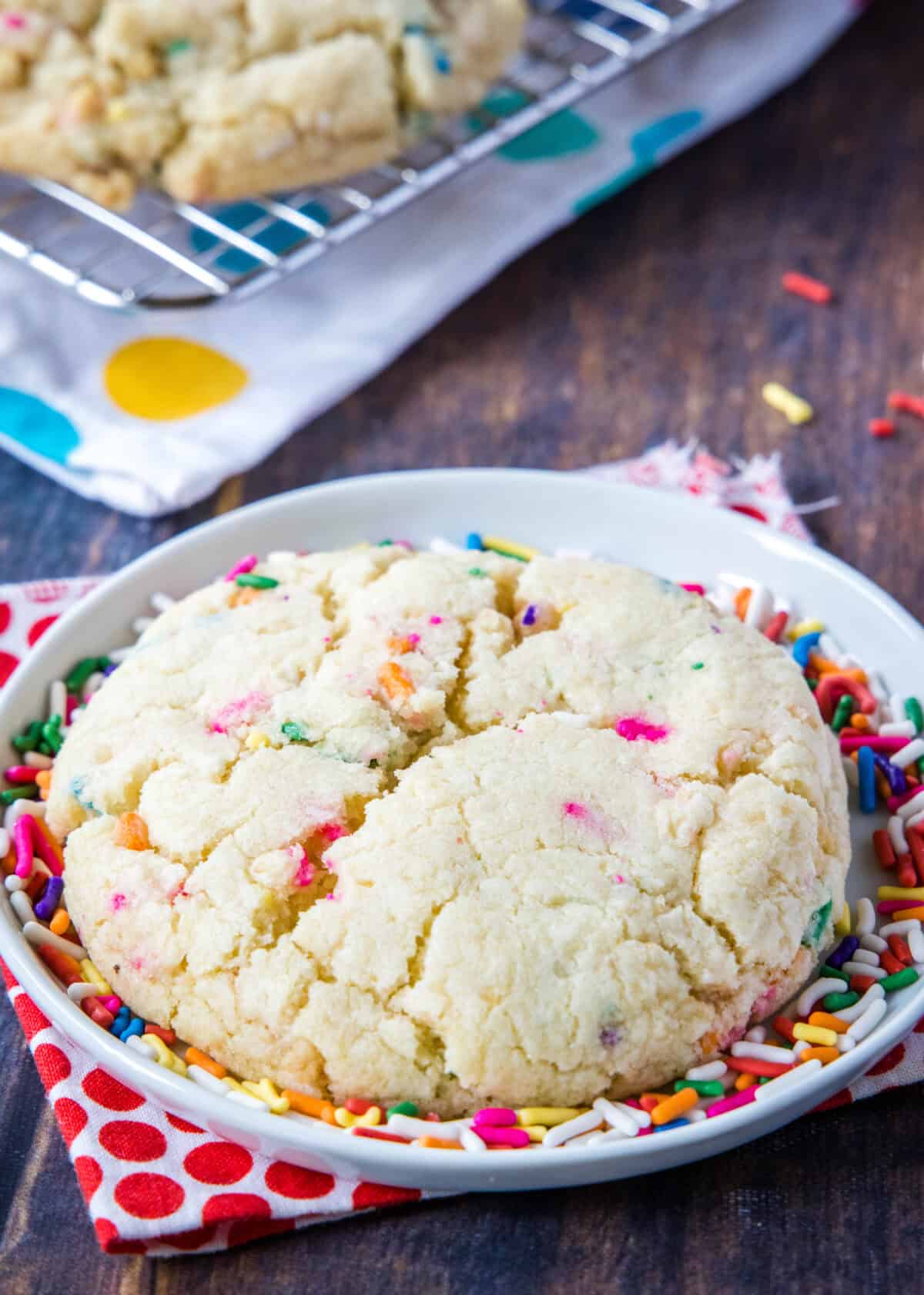 These Milk Bar Confetti Cookies are a copycat of Christina Tosi’s famous recipe — crispy edges, chewy centers, birthday cake crumbs, and loads of rainbow sprinkles.