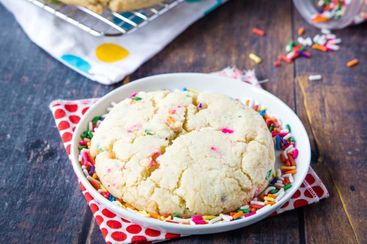 birthday cake confetti cookie on a plate with sprinkles