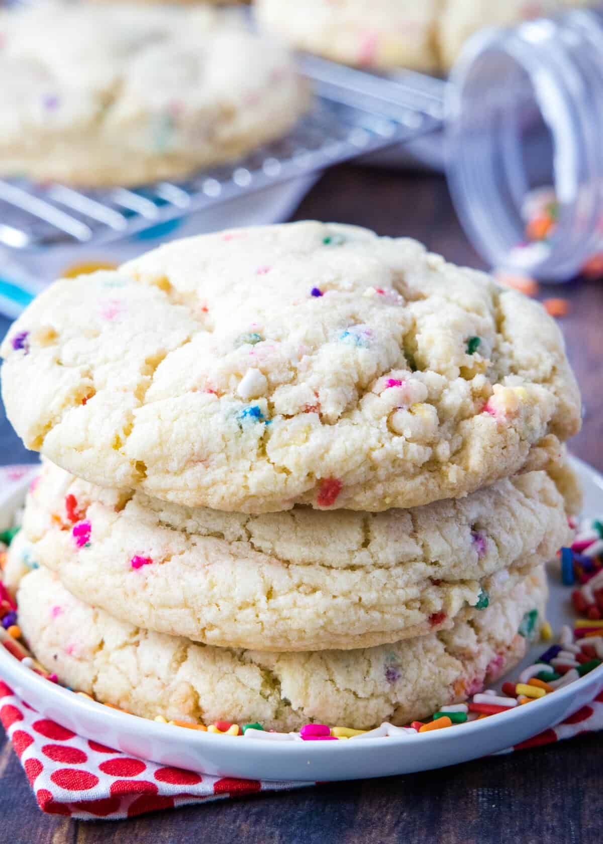 3 milk bar confetti cookies stacked on a plate