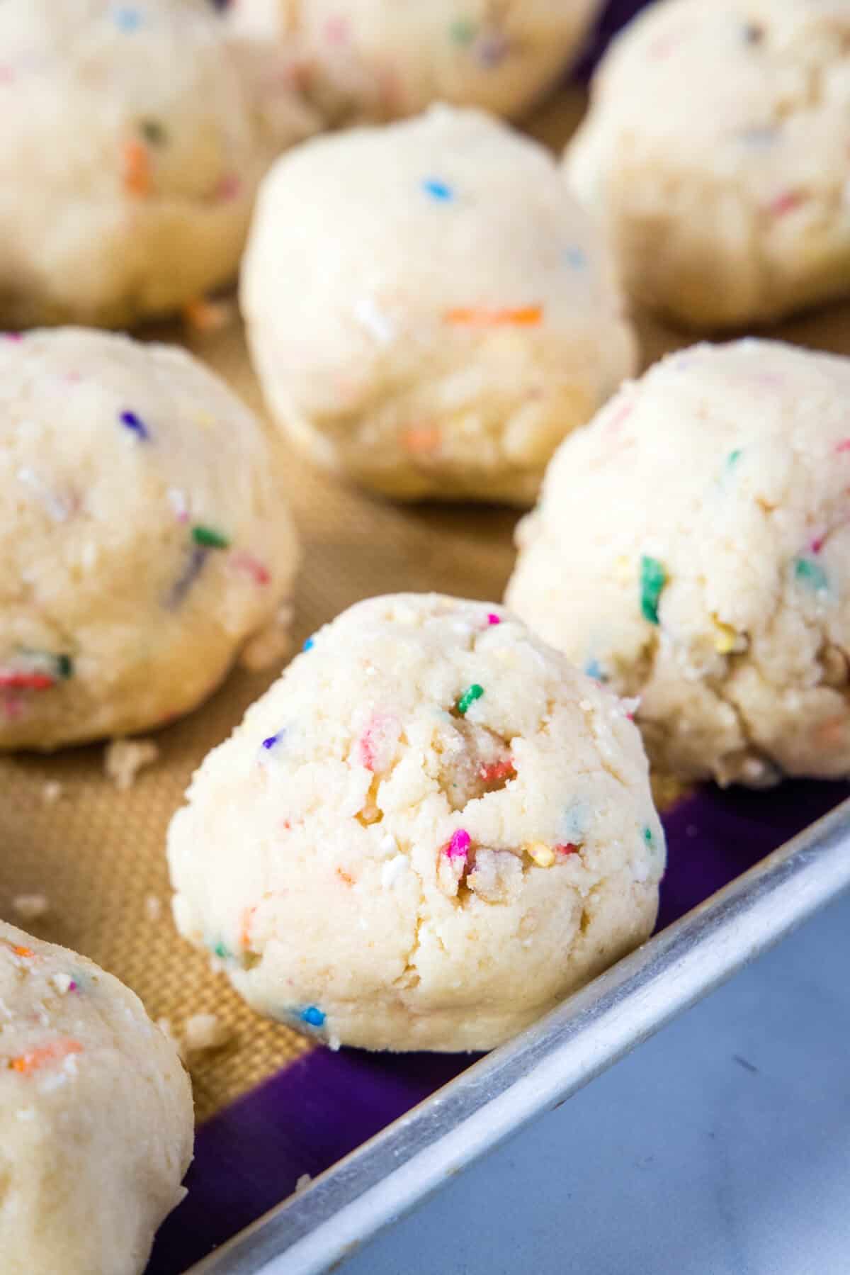 balls of cookie dough on a tray