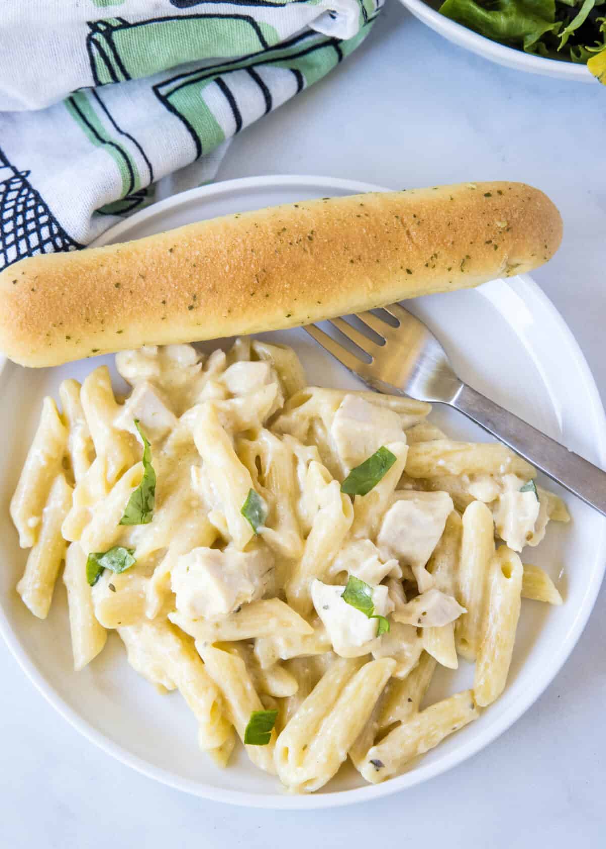looking down on plate of olive garden chicken pasta