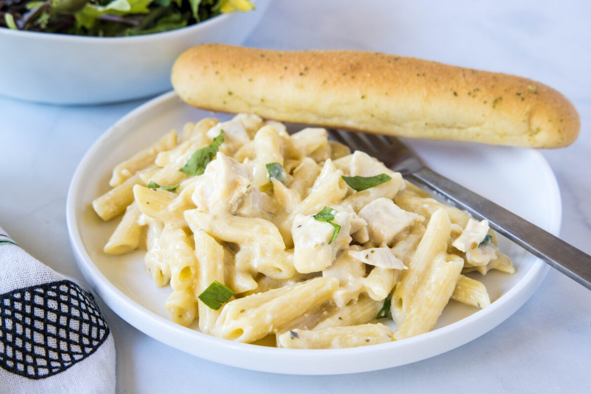 This slow cooker Olive Garden chicken pasta is creamy, cheesy, and ready with just 5 ingredients. A dump-and-go weeknight dinner the whole family will love!