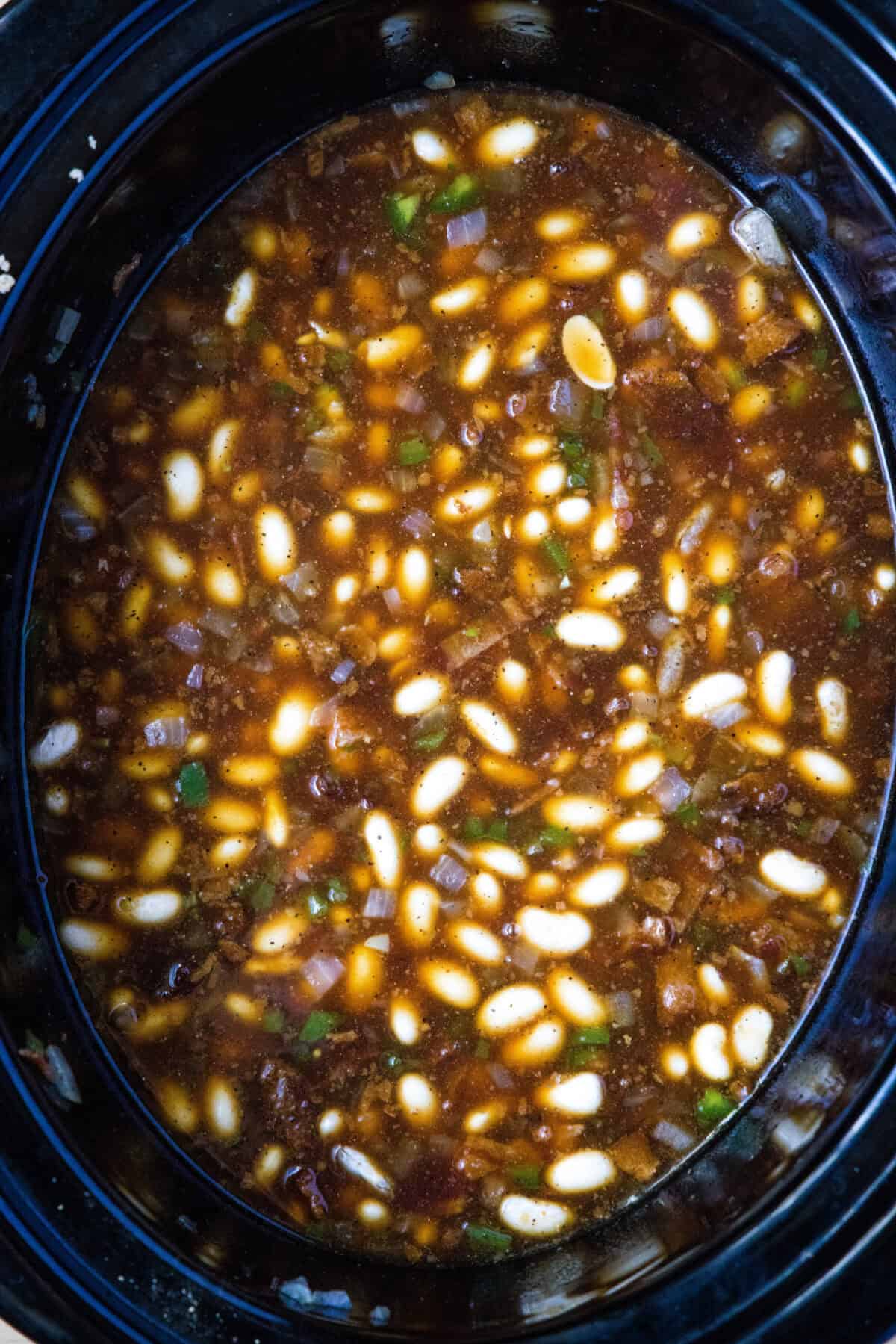 baked beans mixed together in crockpot ready to cook