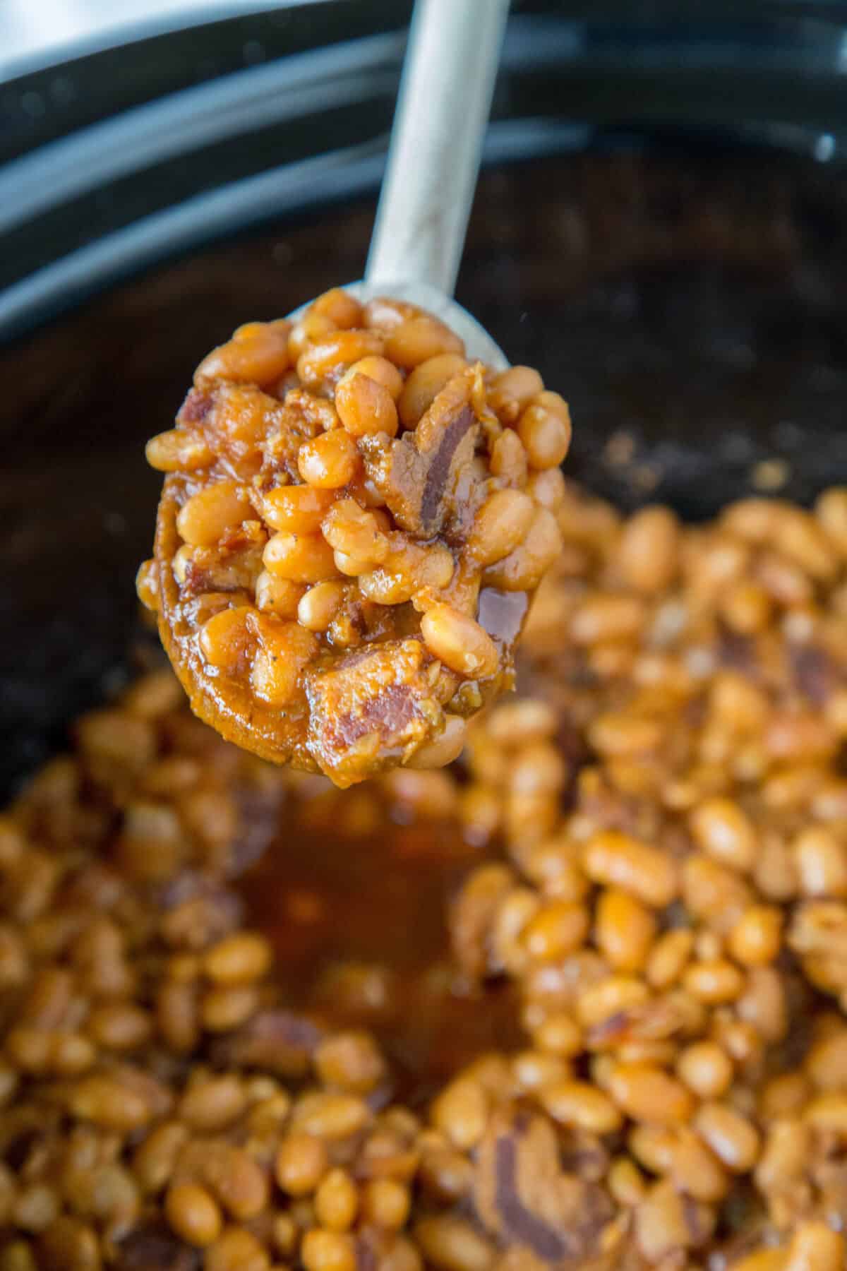 spooning beans out of crockpot