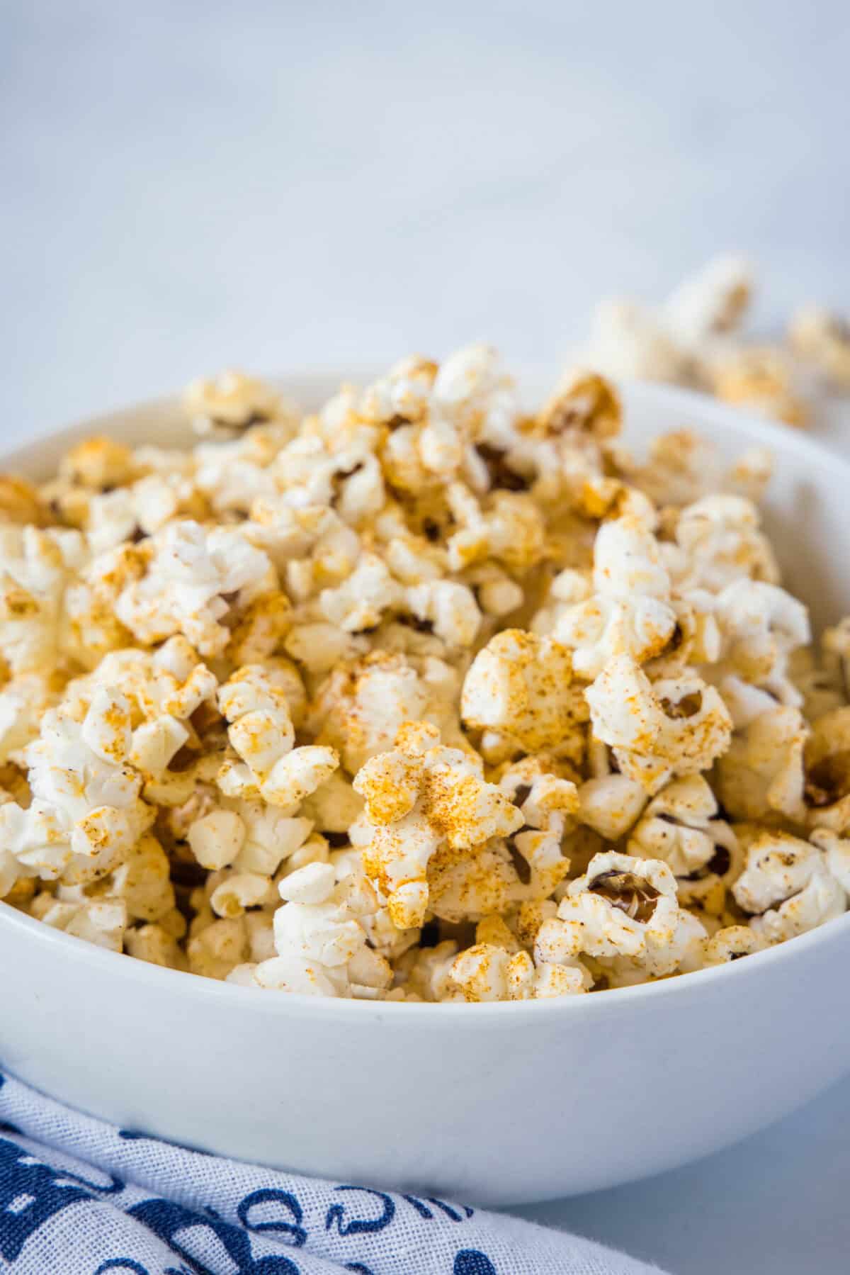 Spicy Popcorn | @dinnersdishesdessert spicy popcorn in white serving bowl