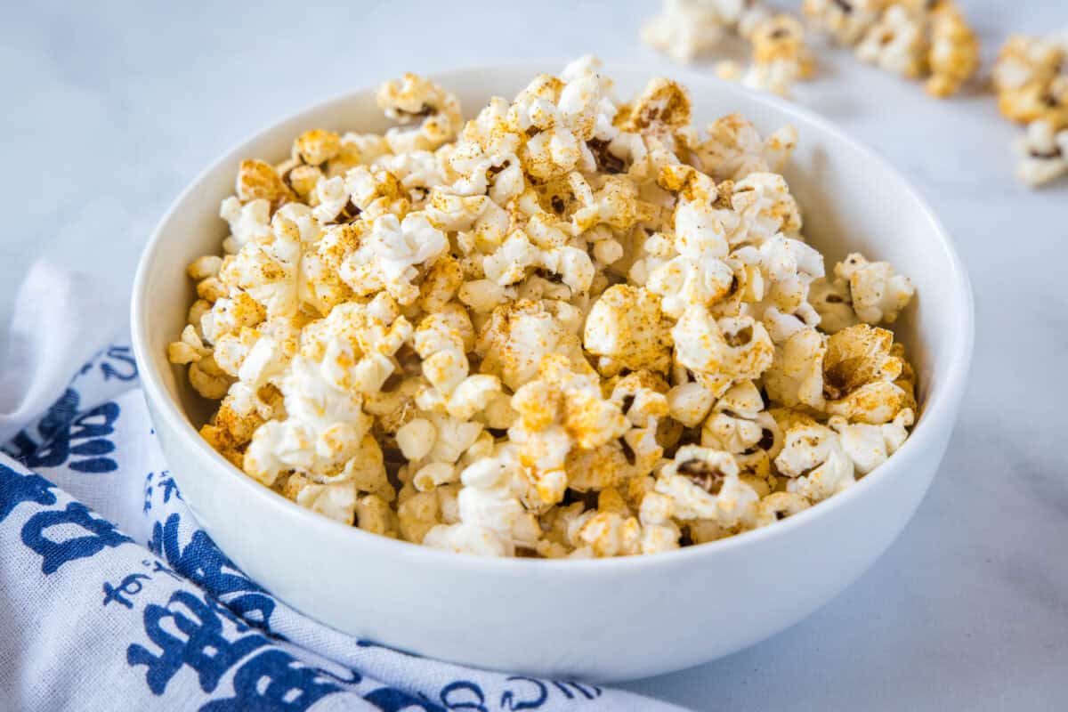 Spicy Popcorn — a quick homemade spice blend turns plain popcorn into a bold, crave-worthy snack in just 10 minutes. Way cheaper (and tastier!) than store-bought flavored popcorn. Save this easy snack recipe for movie night, game day, or anytime the snack attack hits!