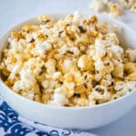 cropped close up spicy popcorn in white bowl