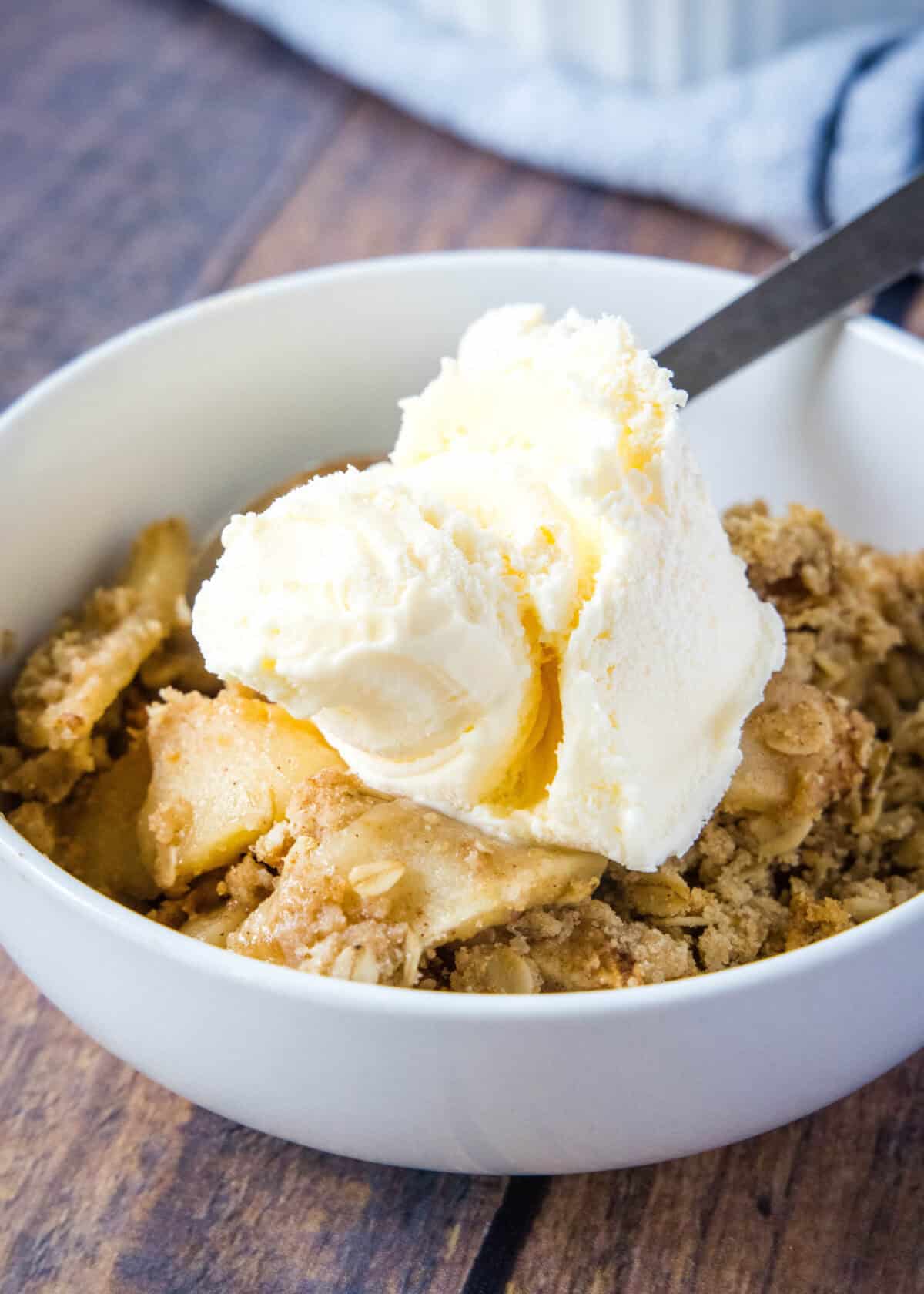 apple crisp with ice cream in a bowl