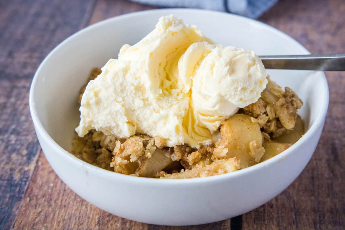 Apple Crisp is the ultimate fall dessert! Tender cinnamon apples baked under a buttery, crisp oat topping - no pie crust required. This easy apple crisp recipe comes together with simple pantry ingredients and is perfect for weeknight desserts, holiday gatherings, or whenever you're craving warm apples and a scoop of vanilla ice cream.