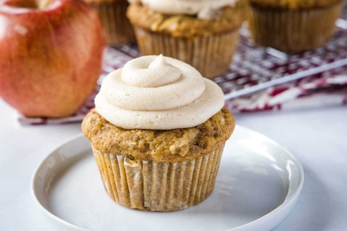 Apple Spice Cupcakes - Classic spice cake with apples and topped with a cinnamon brown sugar frosting. The perfect apple cupcakes for fall!