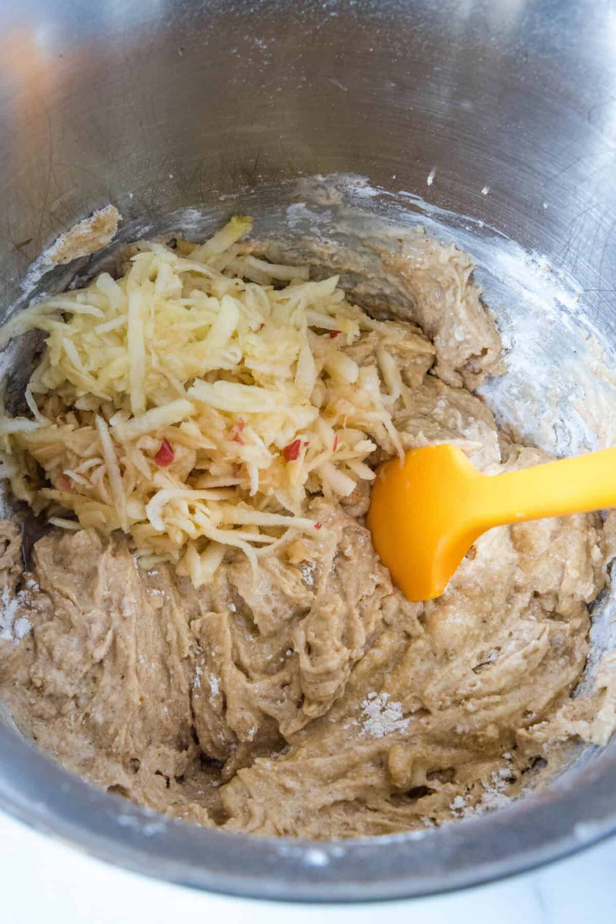 adding shredded apple cup cupcake batter