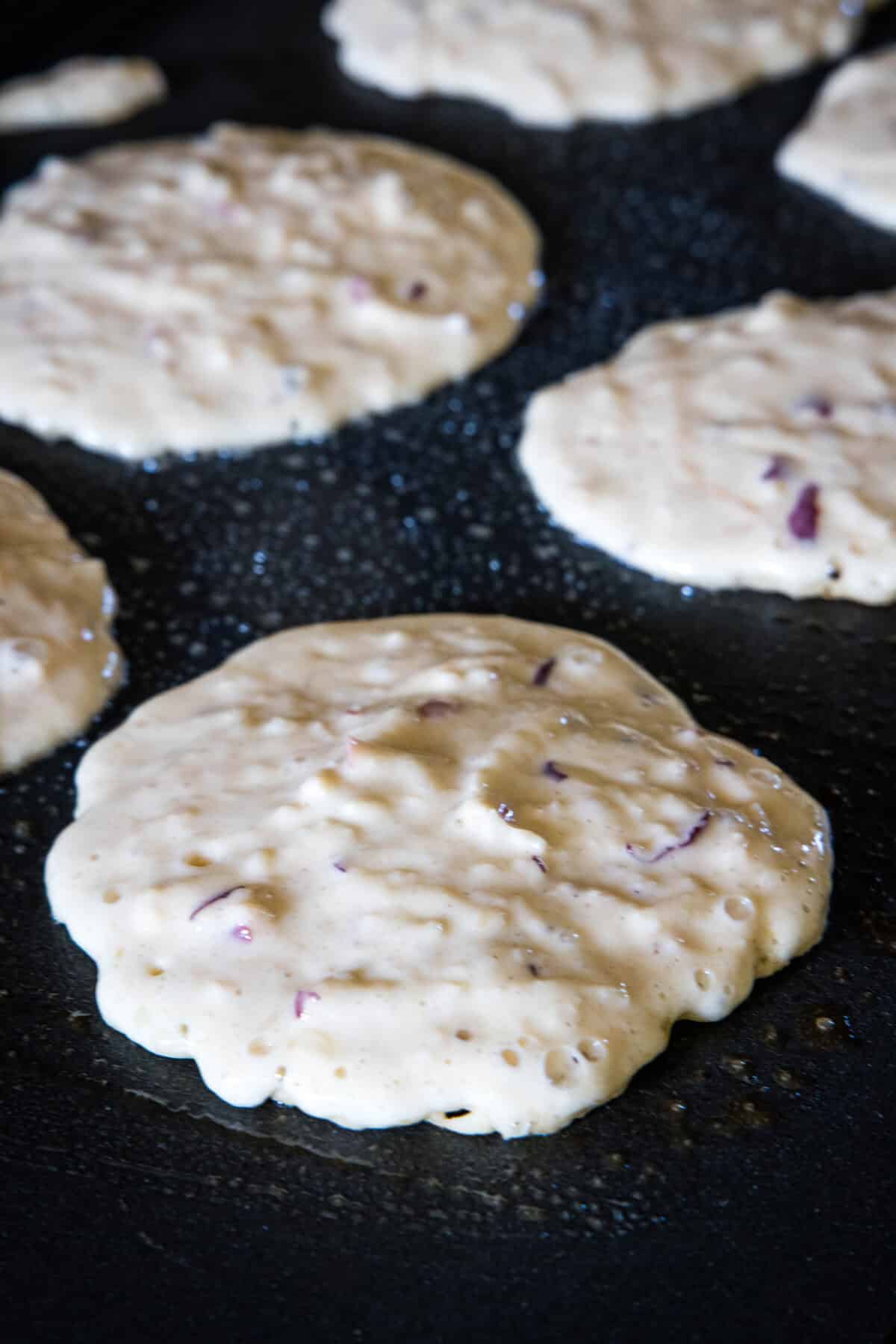 apple pancakes on griddle