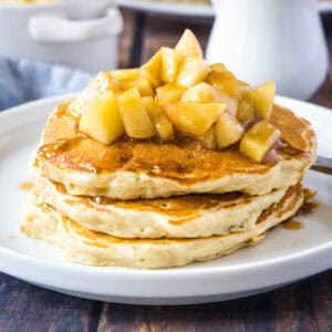 close up stacked apple pancakes on a plate