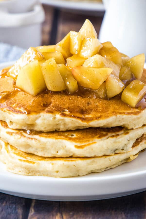 close up stacked apple pancakes on a plate