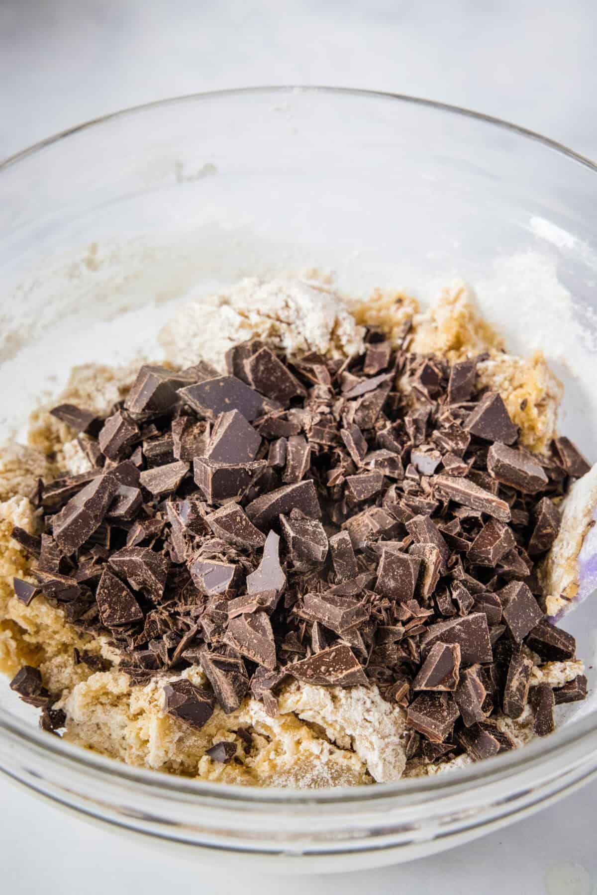 adding chocolate to cookie dough