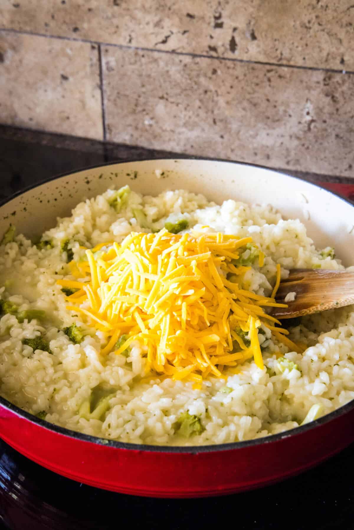 adding cheese to broccoili rice