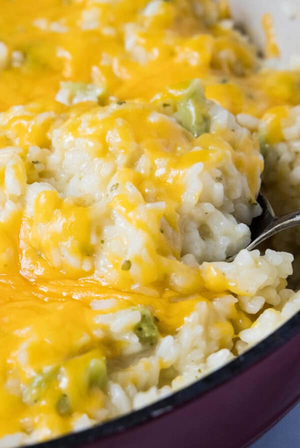 close up scooping rice from skillet