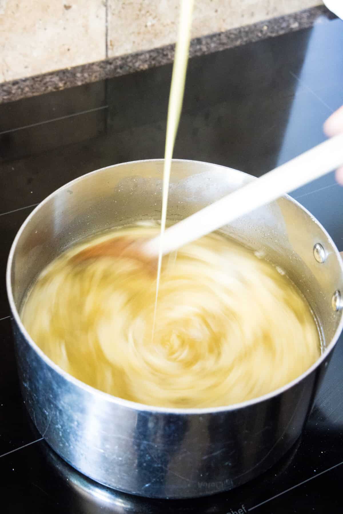 swirling eggs into egg drop soup