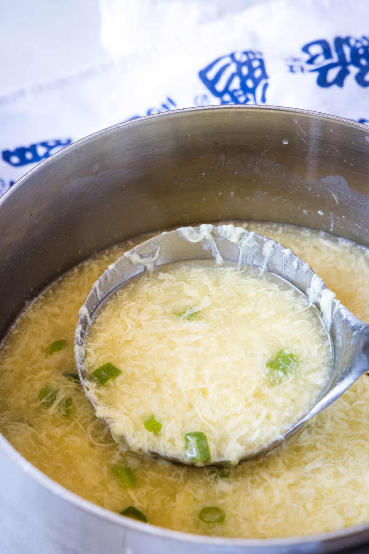 laddle in a pot of egg drop soup