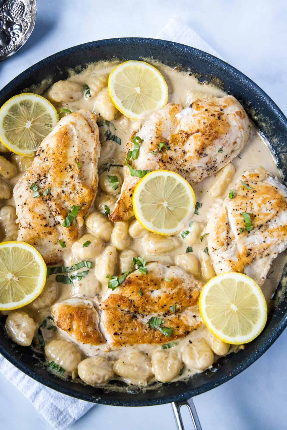 looking down on skillet with lemon chicken gnocchi