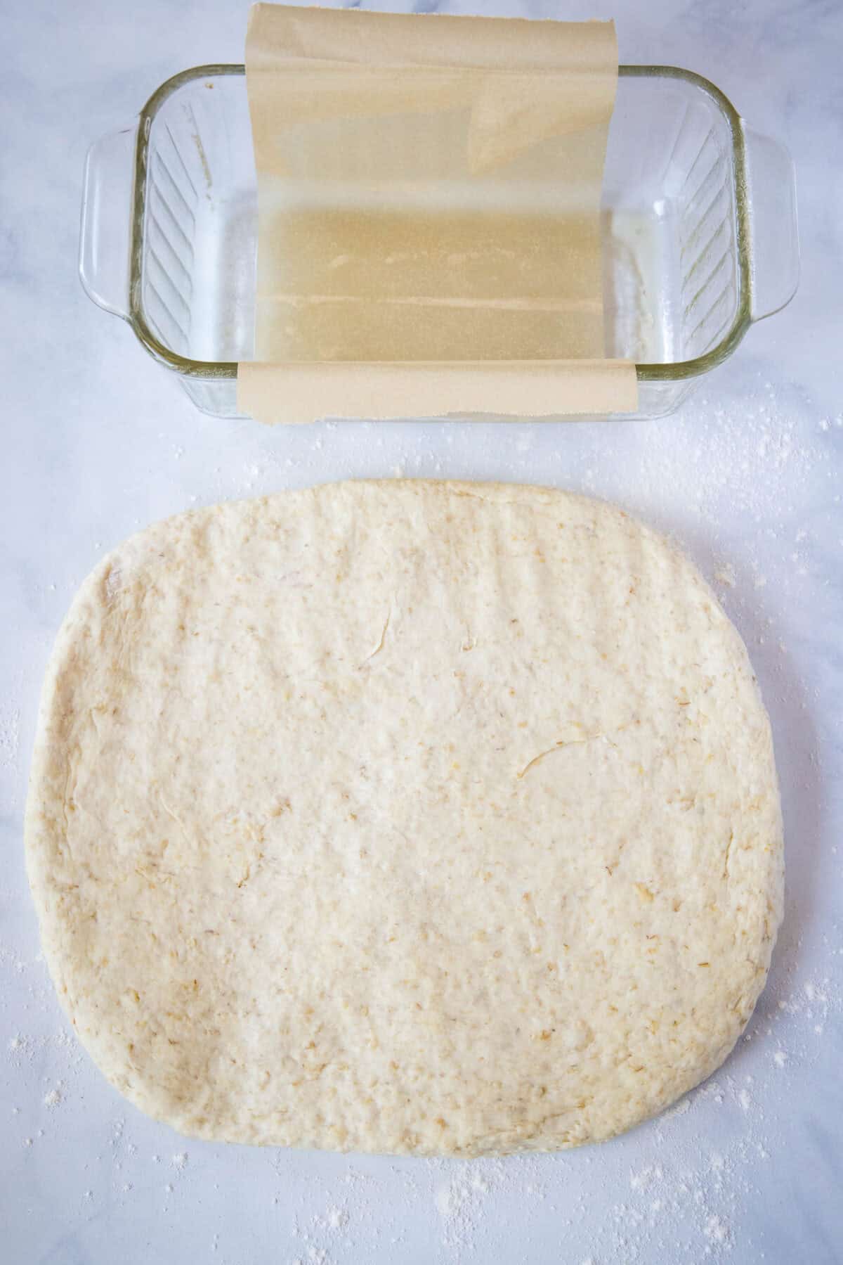 bread dough in a rectangle ready to roll