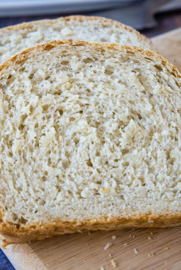cropped close up slice oatmeal bread on cutting board