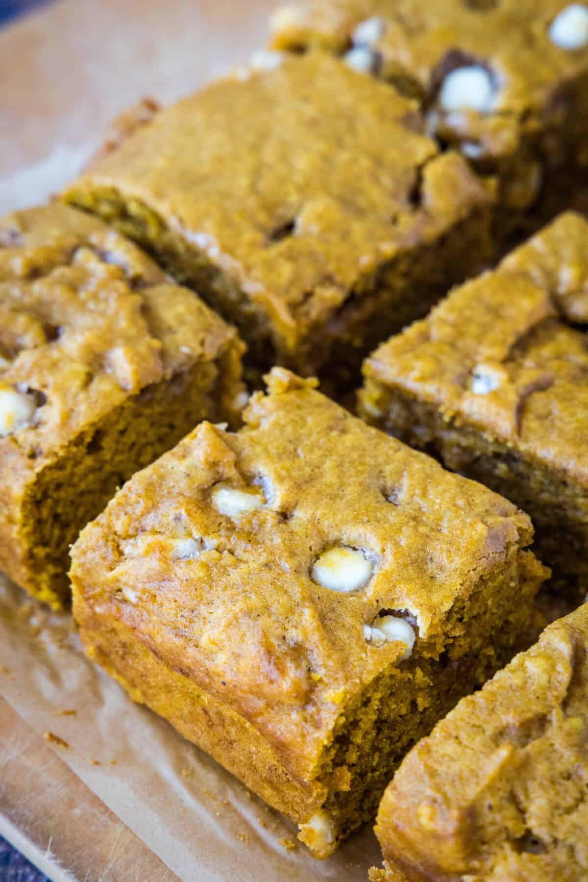 sliced pumpkin blondies on a cutting board