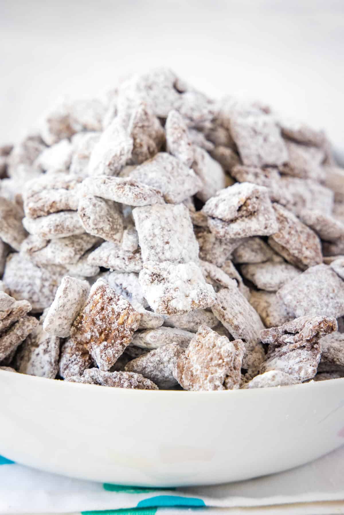 a serving bowl with muddy buddies