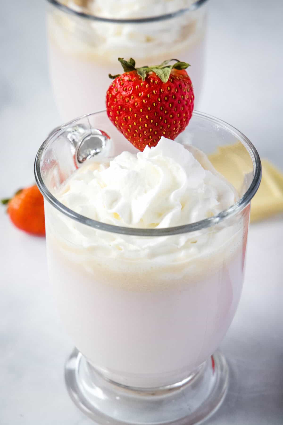 mug of strawberry hot chocolate topped with whipped cream