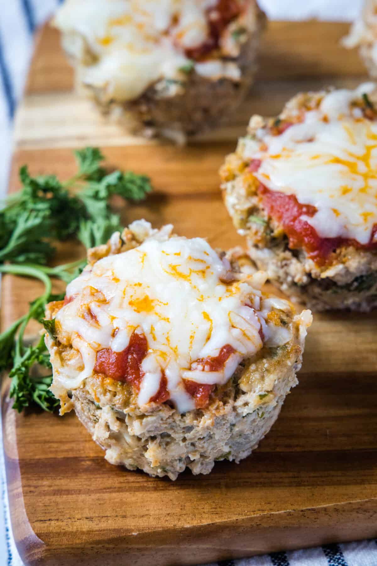 looking down on turkey meatloaf muffin cups on cutting board