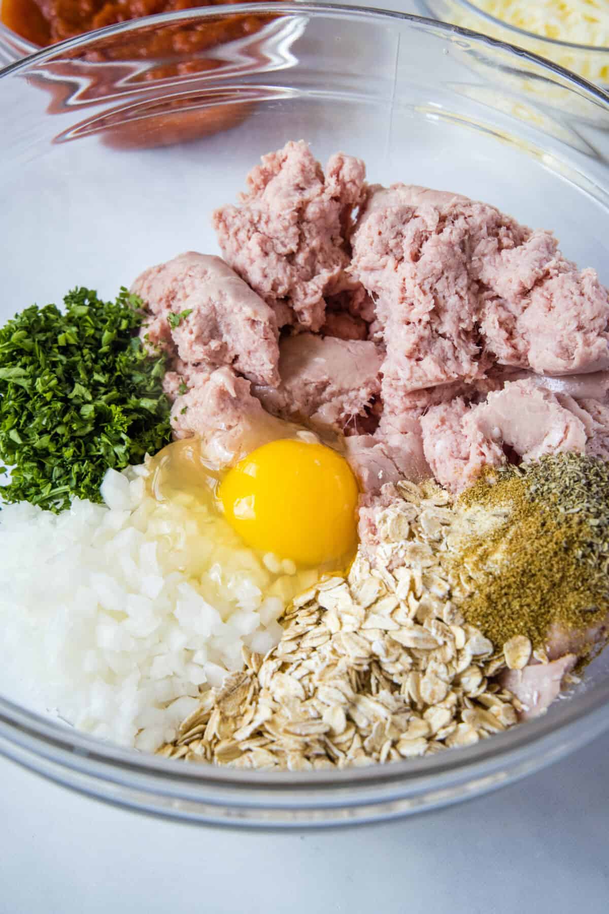 turkey meatloaf ingredients in mixing bowl