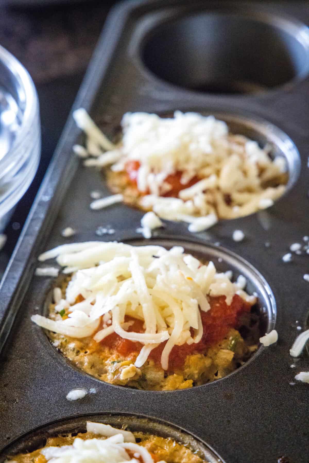Turkey Quinoa Muffin Cups 3 square turkey meatloaf muffins topped with cheese