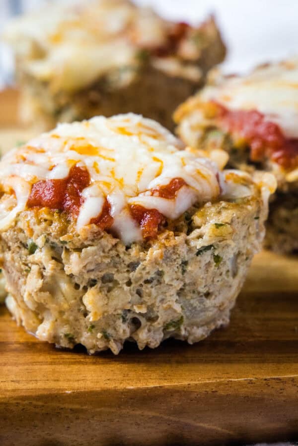 close up turkey meatloaf muffin cups on cutting board