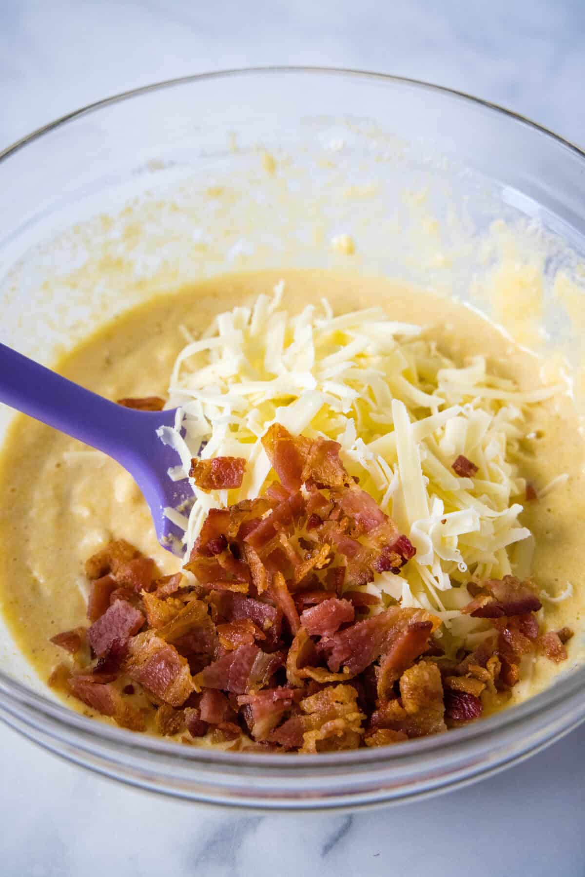 adding bacon and cheese to batter
