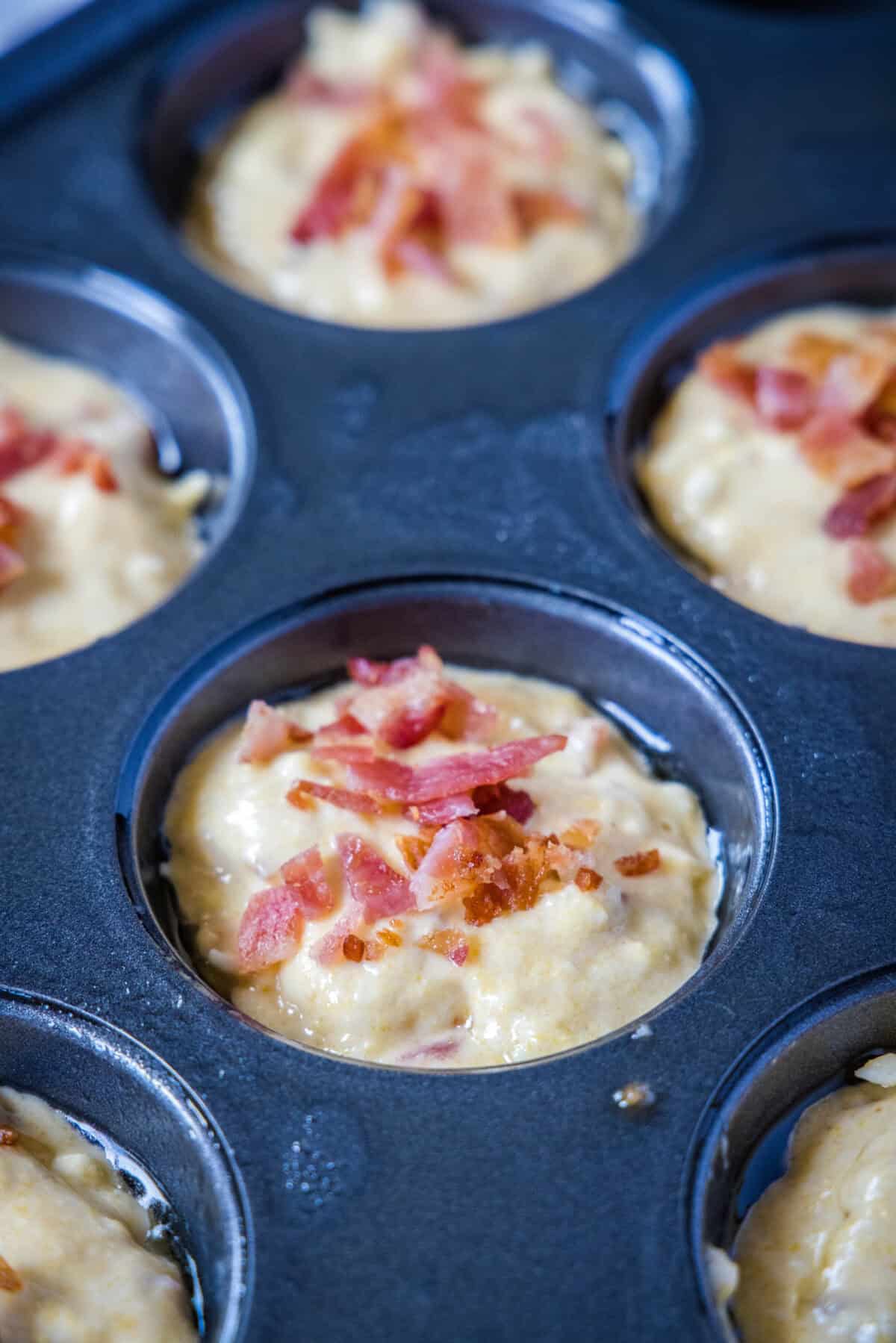bacon corn muffins batter in muffin pan