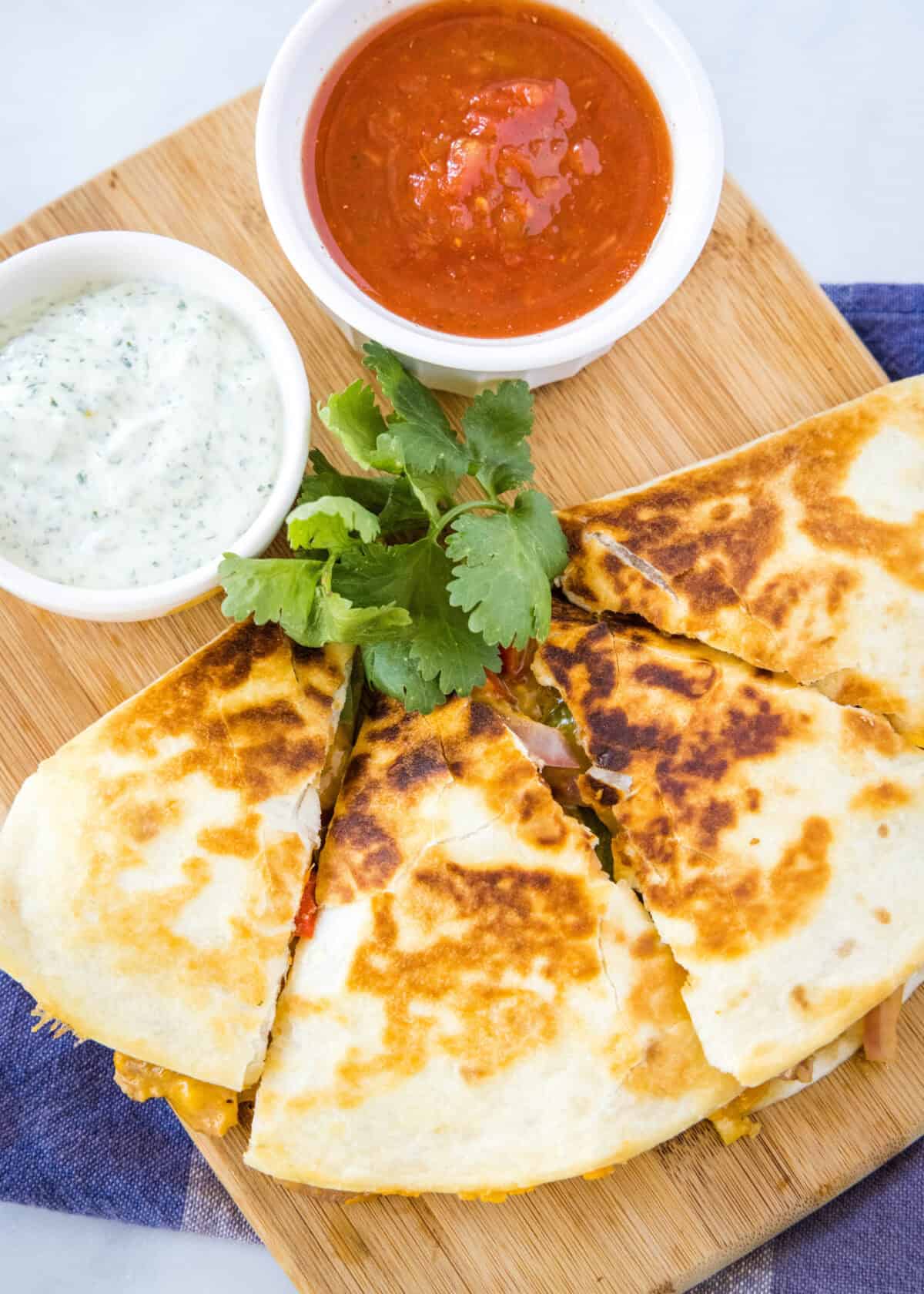 sliced chicken fajita quesadilla on a cutting board