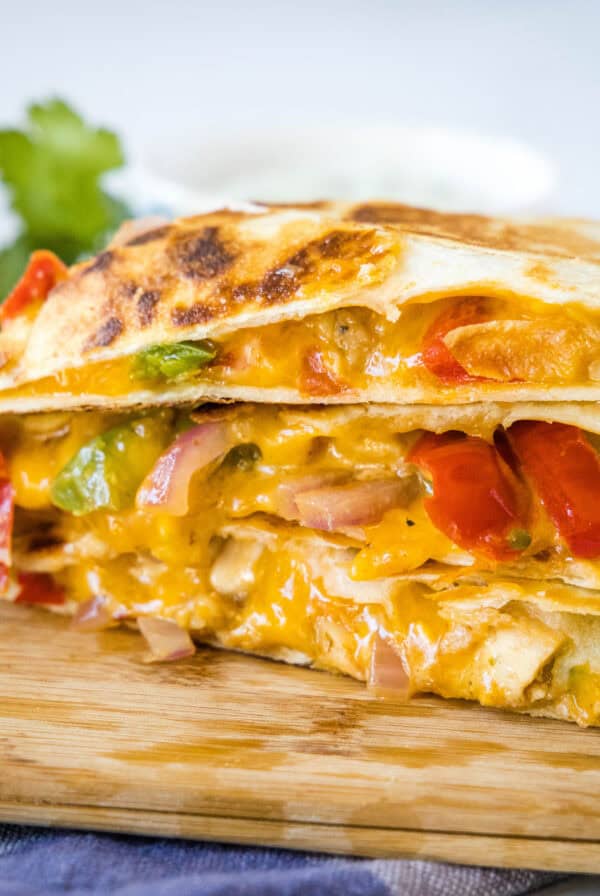 close up chicken fajita quesadilla on a cuttin board