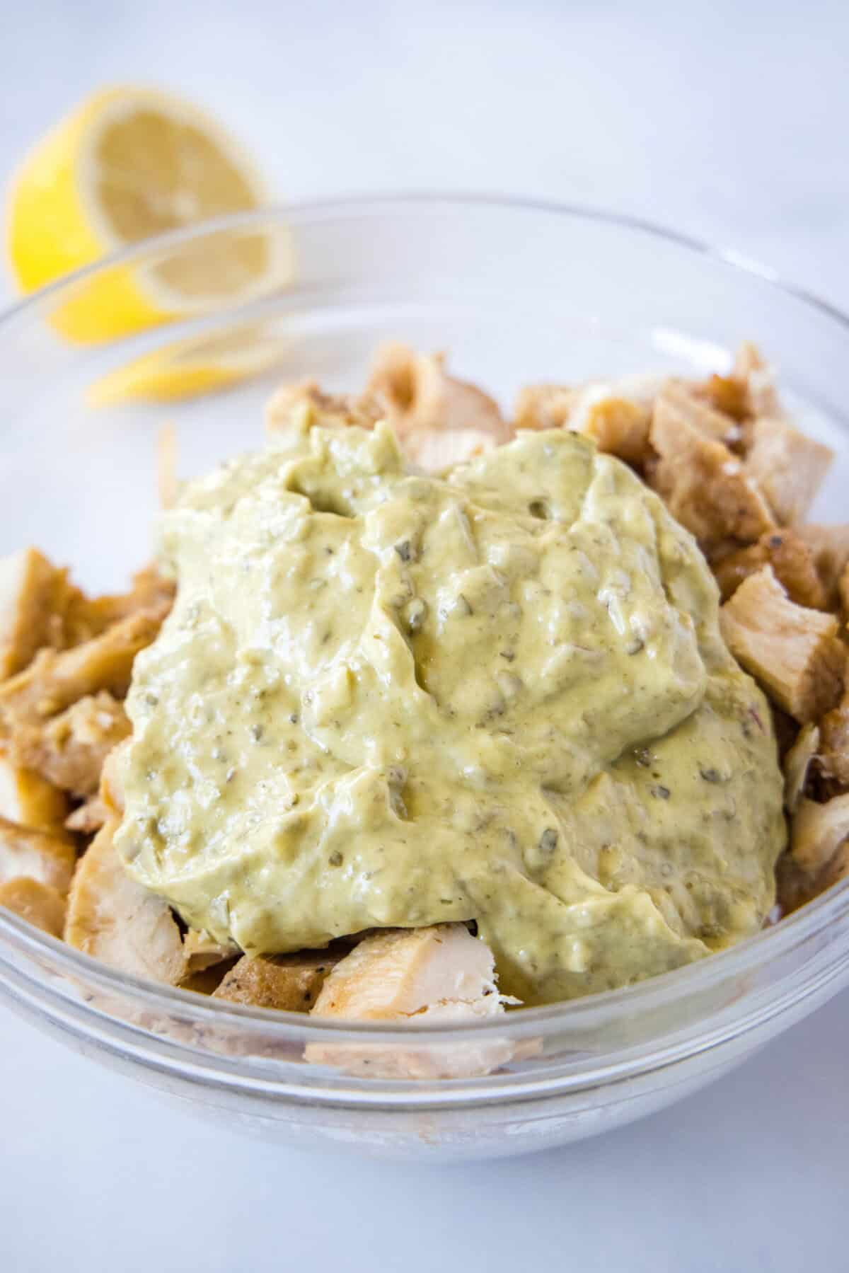 pesto chicken salad dressing over shredded chicken