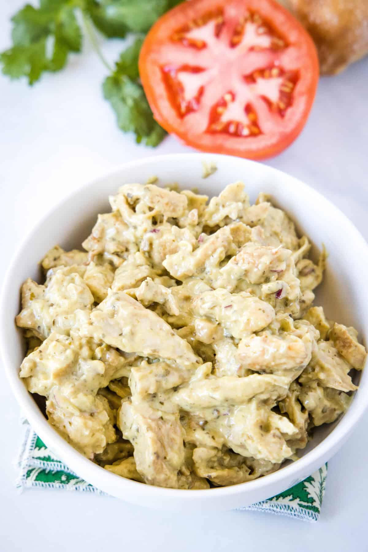 looking down on pesto chicken salad in a bowl