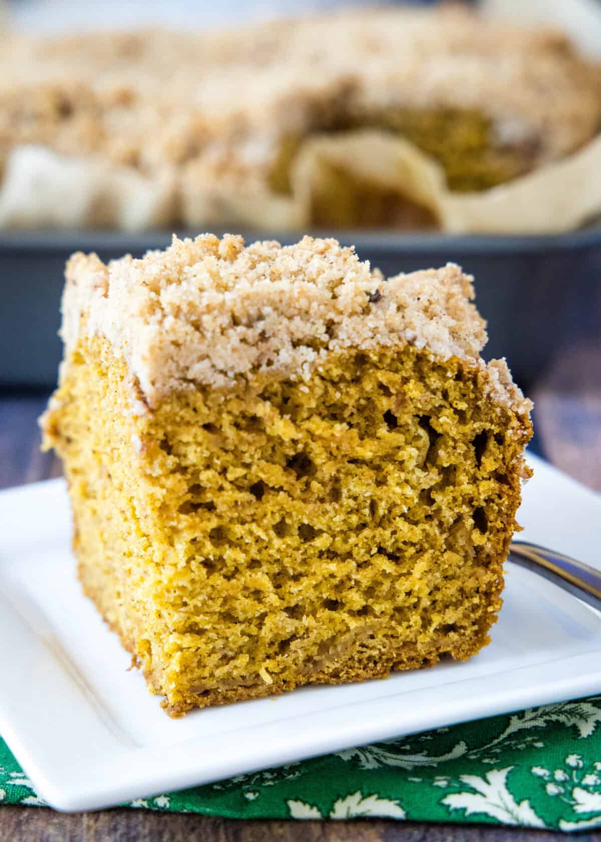 pumpkin coffee cake sliced on a plate