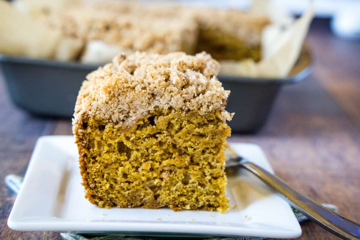 pumpkin coffee cake sliced on a plate