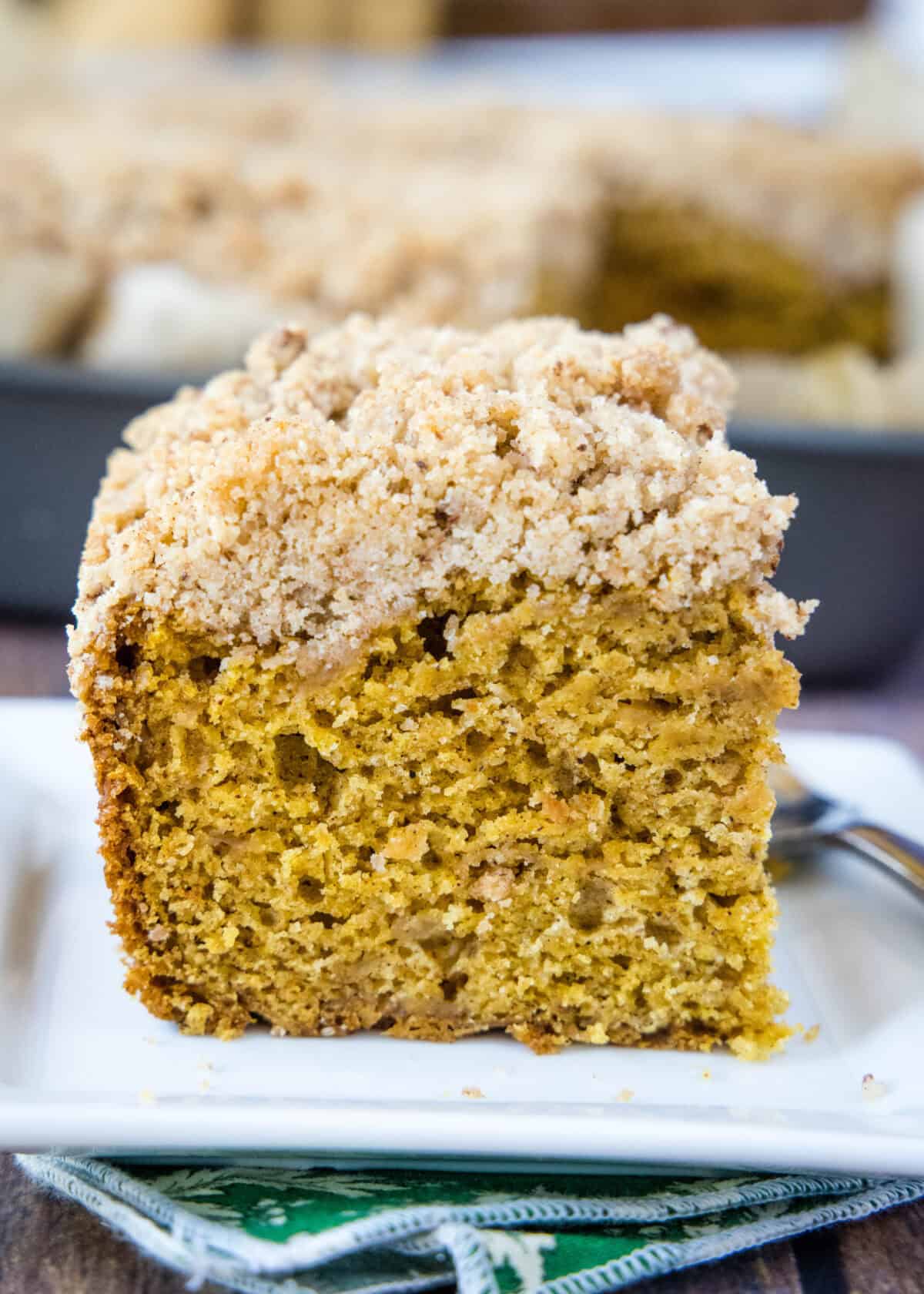 pumpkin coffee cake sliced on a plate