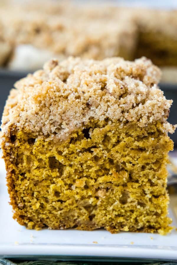 pumpkin coffee cake sliced on a plate