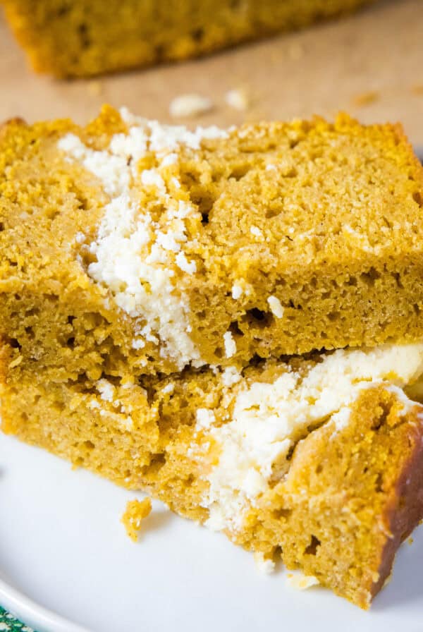 close up pumpkin cream cheese bread sliced on a plate