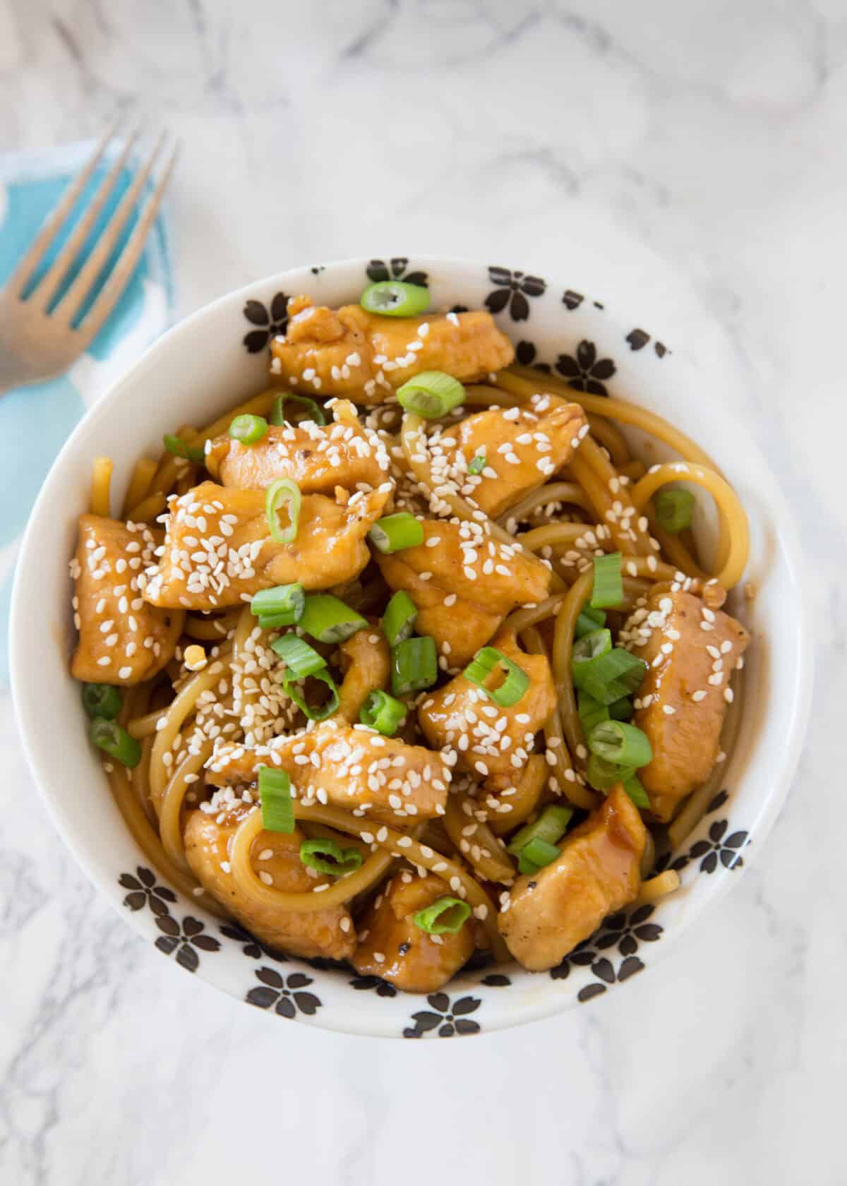 looking down on teriyaki chicken noodles in a bowl
