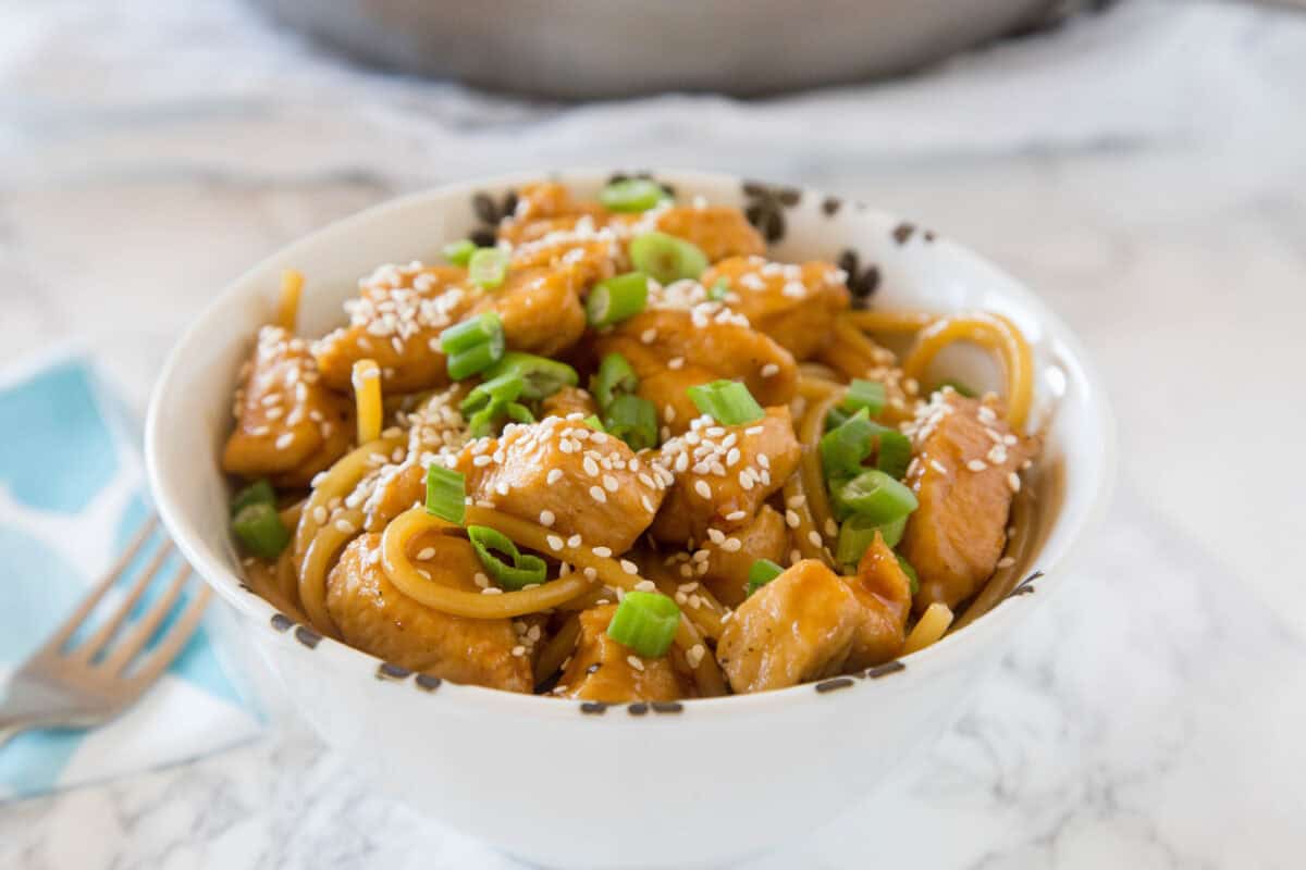 Easy teriyaki chicken noodle bowls made in 25 minutes with homemade sauce, tender chicken, and noodles!