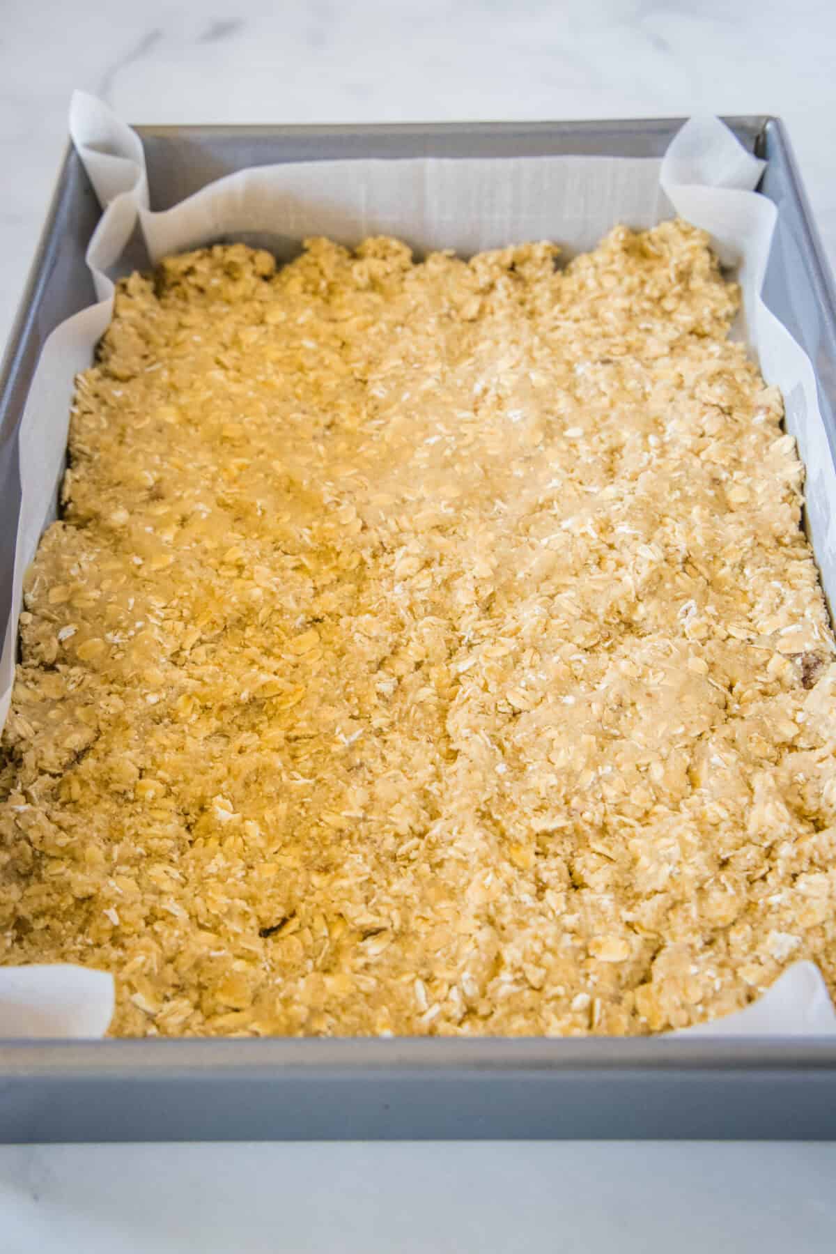 dough pressed into the bottom of a pan